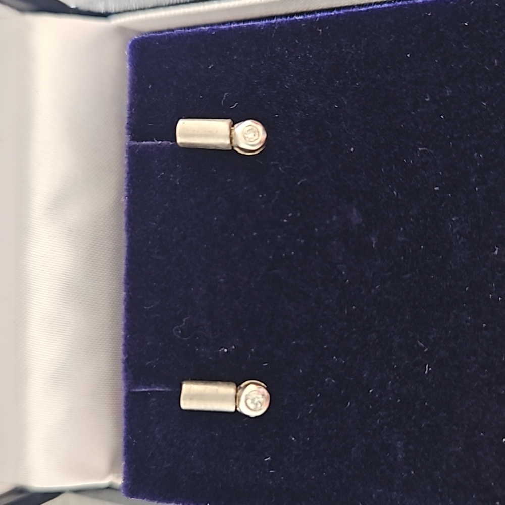 White gold and diamond pierced earrings.